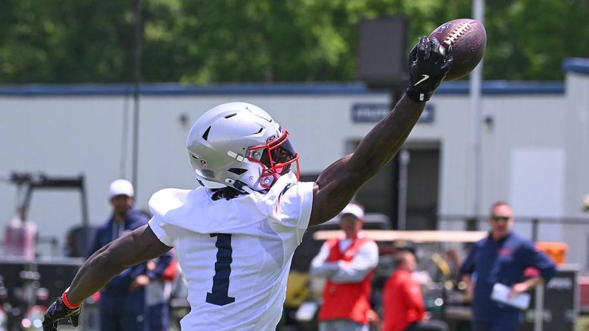  Jun 2, 2026; Foxborough, MA, USA; New England Patriots wide receiver A.J. Brown (1) reaches out for the ball during the team's OTA at Gillette Stadium. Mandatory Credit: Eric Canha-Imagn Images | Eric Canha-Imagn Images 