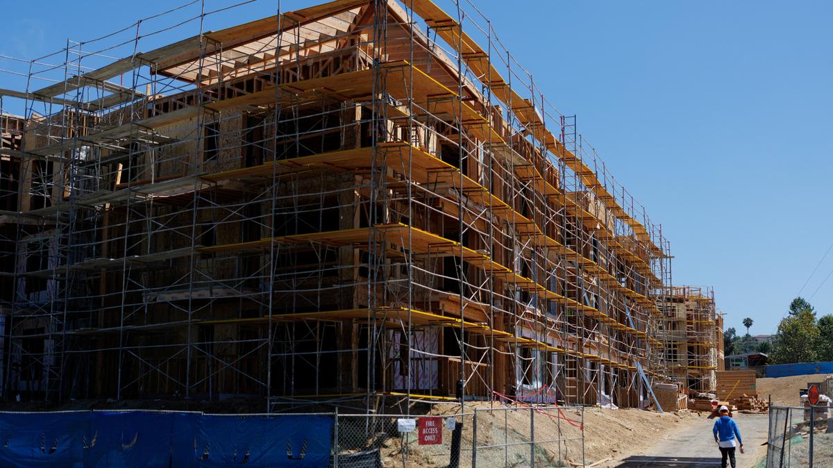 A construction worker is shown on the job site at a multi-unit residential housing project in Encinitas, California, U.S., July 28, 2025. REUTERS/Mike Blake