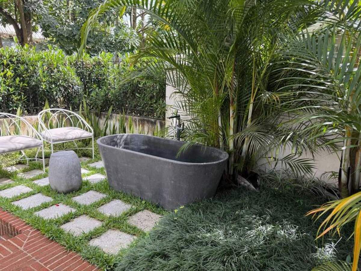  Tucked away in a private garden, this outdoor bathtub is the ultimate setting for Villa Bokéh's signature Bougainvillea Bath Ritual. Photo credit: Gentry Hale 