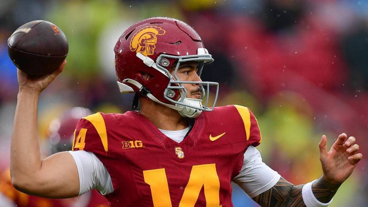  Nov 15, 2025; Los Angeles, California, USA; Southern California Trojans quarterback Jayden Maiava (14) throws against the Iowa Hawkeyes during the first half at the Los Angeles Memorial Coliseum. Mandatory Credit: Gary A. Vasquez-Imagn Images | Gary A. Vasquez-Imagn Images 