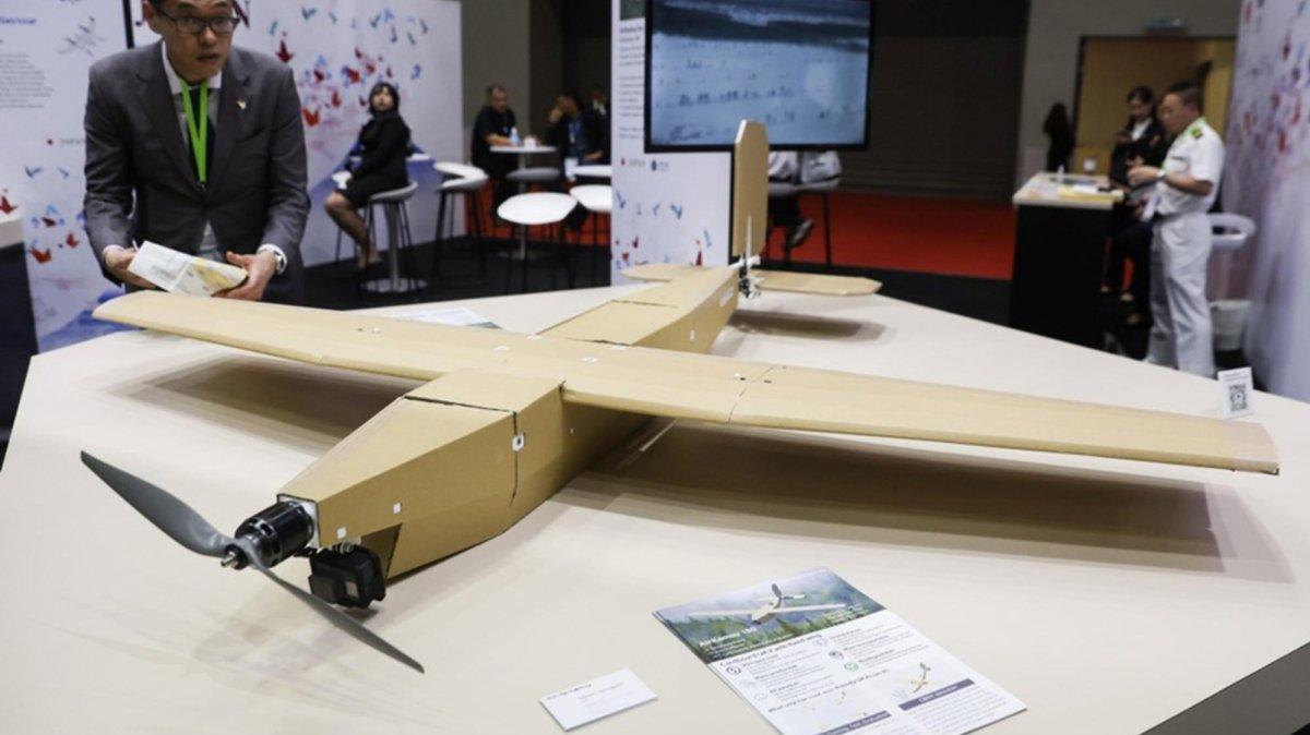 A visitor examines the 'AirKamuy 150,' a low-cost fixed-wing drone constructed from cardboard and developed by Japanese startup AirKamuy, at the Defence Services Asia (DSA) and National Security (NATSEC) Asia 2026 exhibition in Kuala Lumpur, Malaysia, 21 April 2026. The defense and security exhibition runs from 20 to 23 April. Photo by FAZRY ISMAIL / EPA