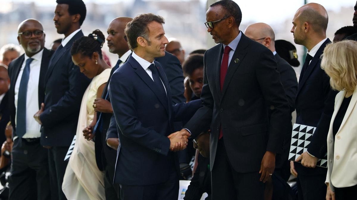 French President Emmanuel Macron shakes hands with Rwandan President Paul Kagame after the inauguration ceremony of a double stele artwork by artist Grada Kilomba, a new memorial site paying tribute to the victims of the Rwanda's genocide at the Habib-Bourgiba esplanade along the River Seine, in Paris, France, June 2, 2026. REUTERS/Sarah Meyssonnier/Pool
