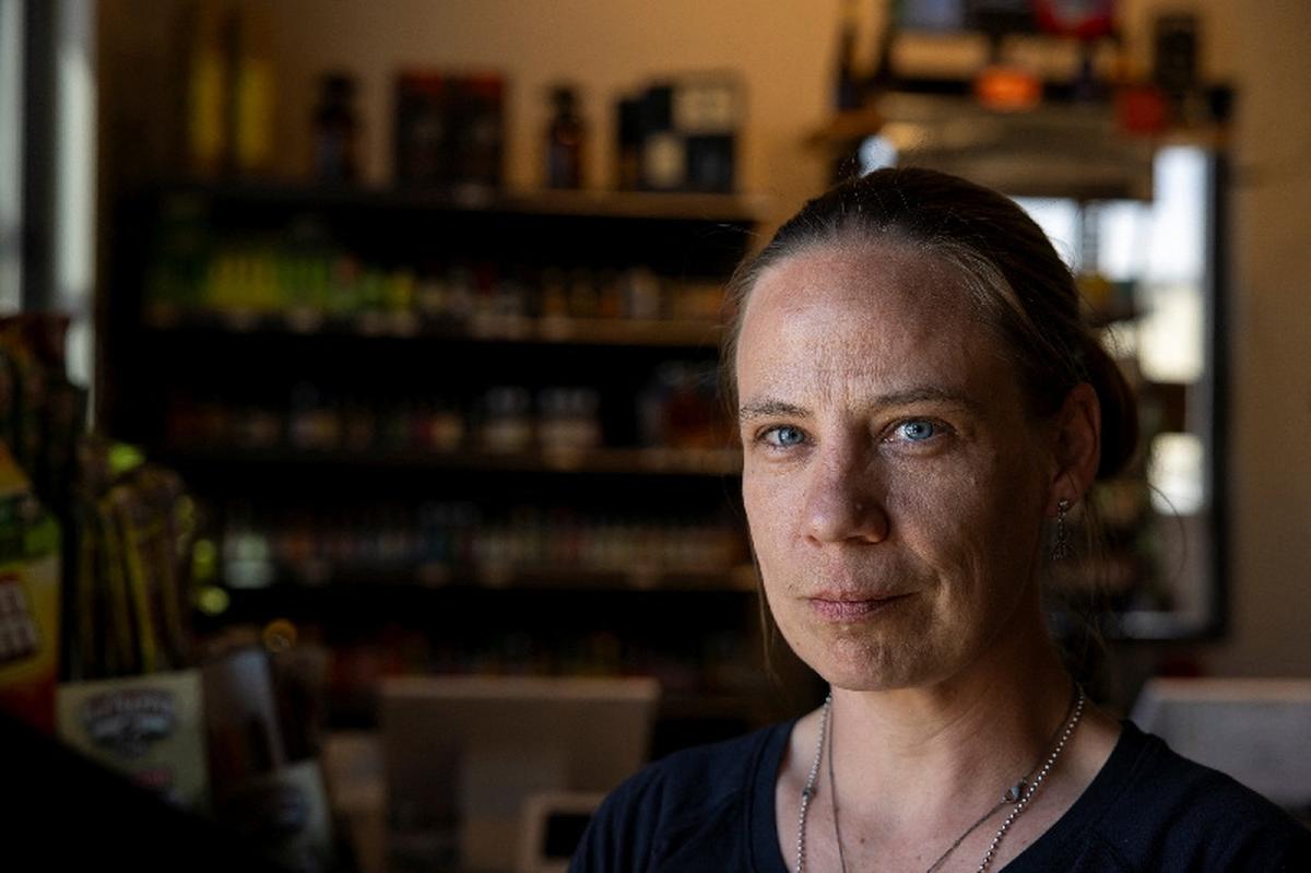 Tanya Bruyette poses for a portrait at the liquor store where she works in Wiggens, Colorado, U.S., May 11, 2026.  REUTERS/Kevin Mohatt