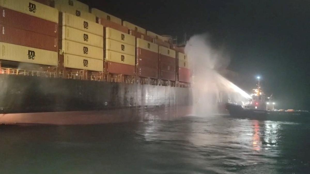 Personnel on a boat work to extinguish a fire on the Sariska V vessel in the Persian Gulf after MSC, the world's largest shipping group, said the vessel was struck by two projectiles in Iraq's Umm Qasr port, in this screengrab from a handout video released June 2, 2026. IRAQI PORTS COMPANY MEDIA/Handout via REUTERS.