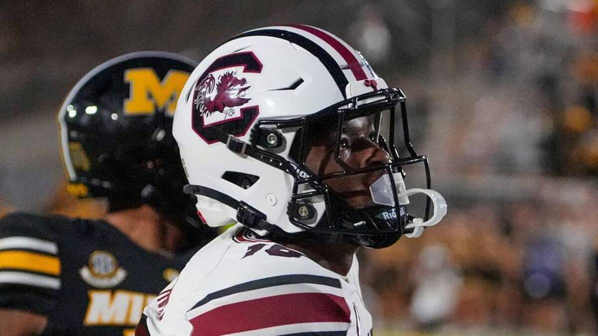  Sep 20, 2025; Columbia, Missouri, USA; South Carolina Gamecocks wide receiver Brian Rowe Jr. (18) catches a pass for a touchdown as Missouri Tigers cornerback Drey Norwood (12) looks on during the first half of the game at Faurot Field at Memorial Stadium. Mandatory Credit: Denny Medley-Imagn Images | Denny Medley-Imagn Images 