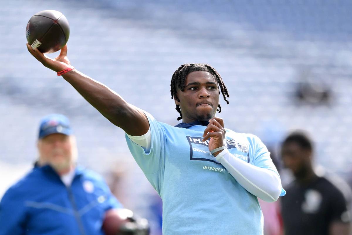  Oct 19, 2025; Nashville, Tennessee, USA; Tennessee Titans quarterback Cam Ward (1) warms up before the game between the New England Patriots and Tennessee Titans at Nissan Stadium. Mandatory Credit: Steve Roberts-Imagn Images 