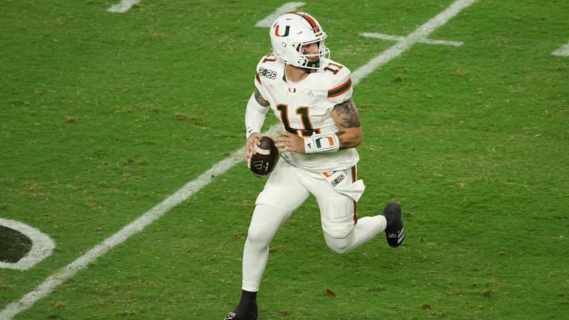  Jan 19, 2026; Miami Gardens, FL, USA; Miami Hurricanes quarterback Carson Beck (11) scrambles with the ball against the Indiana Hoosiers in the third quarter during the College Football Playoff National Championship game at Hard Rock Stadium. Mandatory Credit: Kim Klement Neitzel-Imagn Images | Kim Klement Neitzel-Imagn Images 