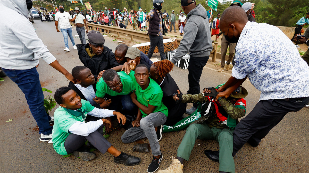 Former Chief Justice David Maraga is detained by plainclothes police officers alongside environmental activists for participating in a march against the encroachment of Nairobi National Park's land and plans to relocate the Nairobi Animal Orphanage in Nairobi, Kenya, June 8, 2026. REUTERS/Thomas Mukoya