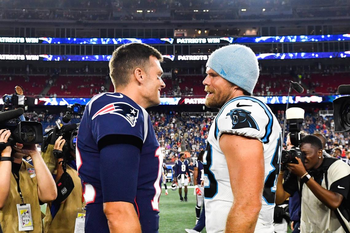  FOXBOROUGH, MA - AUGUST 22: Tom Brady #12 of the New England Patriots meets with Greg Olsen #88 of the Carolina Panthers following the Patriots 10-3 preseason victory at Gillette Stadium on August 22, 2019 in Foxborough, Massachusetts. (Photo by Kathryn Riley/Getty Images) 