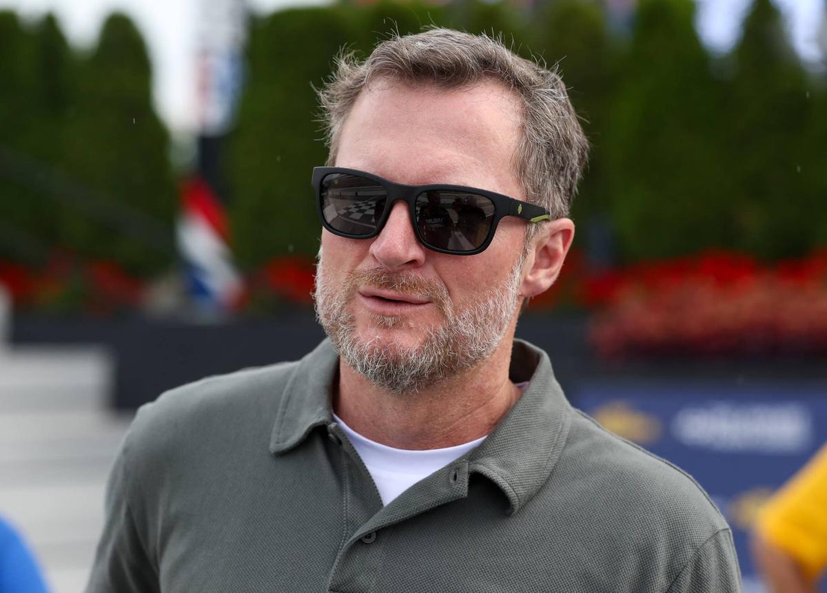  Jul 19, 2025; Dover, Delaware, USA; NASCAR Xfinity Series owner Dale Earnhardt Jr. looks on from pit road during the BetRivers 200 at Dover Motor Speedway. Mandatory Credit: Matthew O'Haren-Imagn Images Matthew O'Haren-Imagn Images.