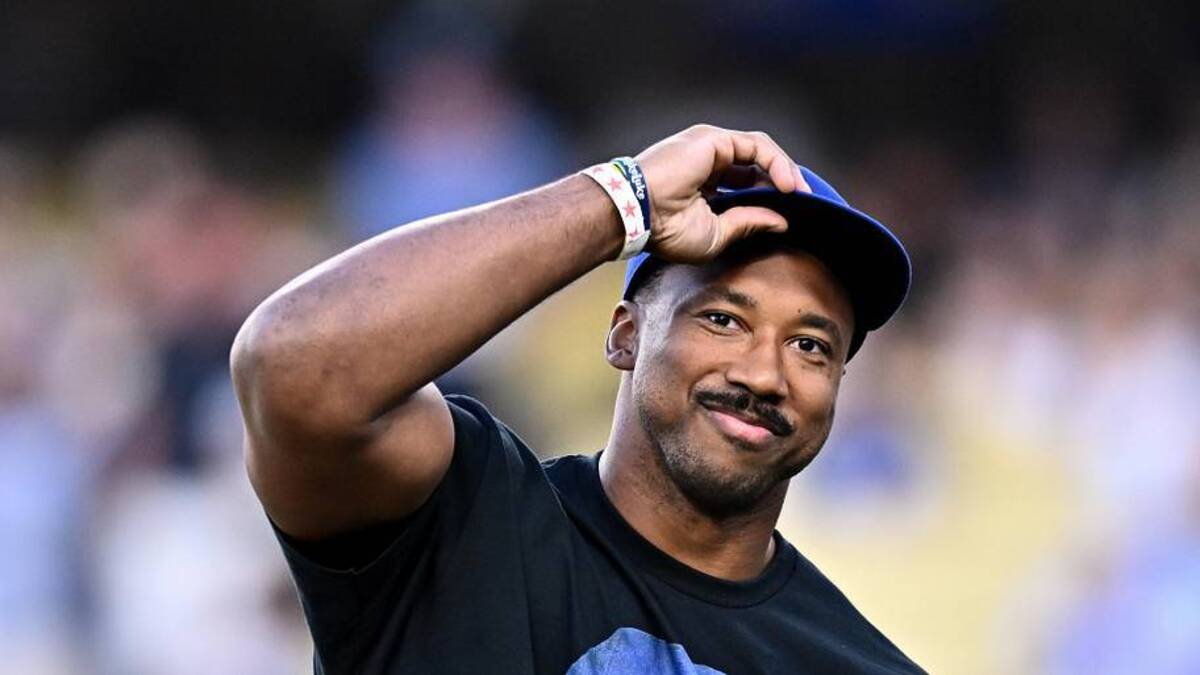  Jun 6, 2026; Los Angeles, California, USA; Los Angeles Rams defensive end Myles Garrett looks on prior to throwing out the honorary first pitch before a game between the Los Angeles Angels and Los Angeles Dodgers at Dodger Stadium. Mandatory Credit: William Liang-Imagn Images | William Liang-Imagn Images 