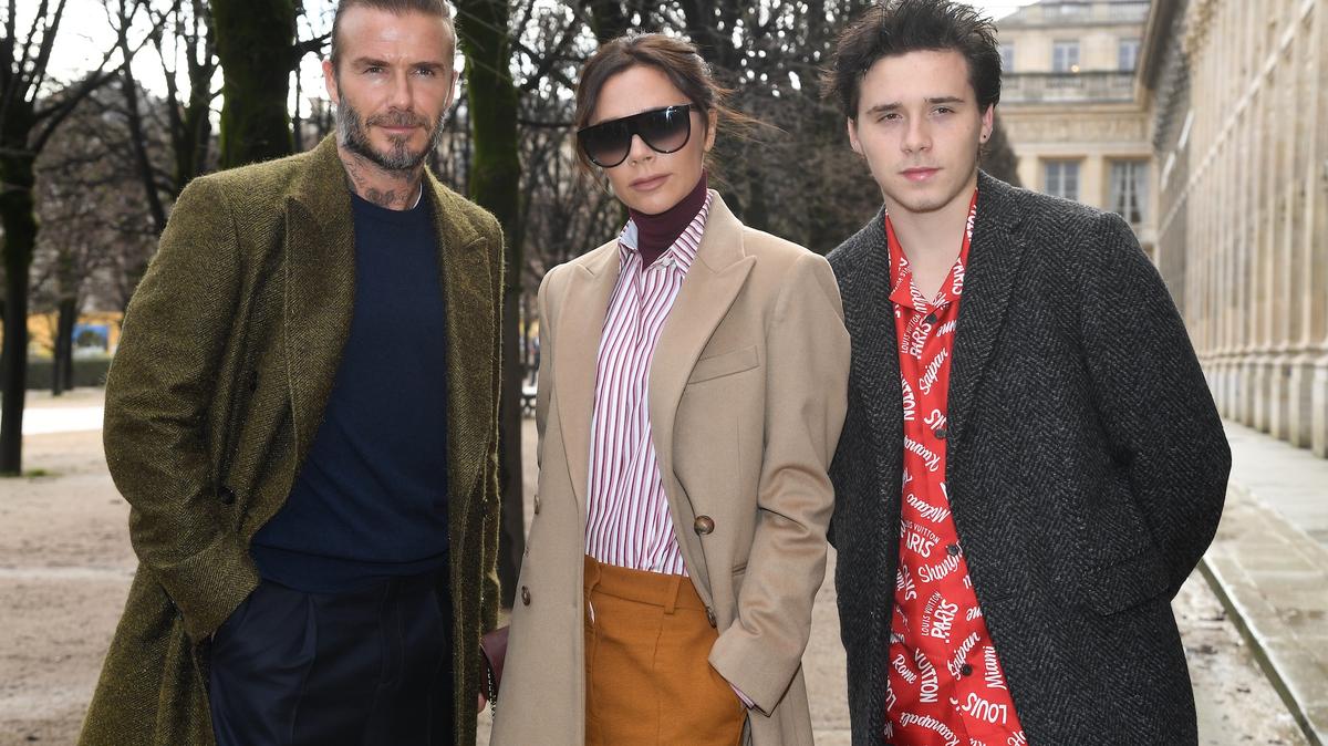 David, Victoria and Brooklyn Beckham.