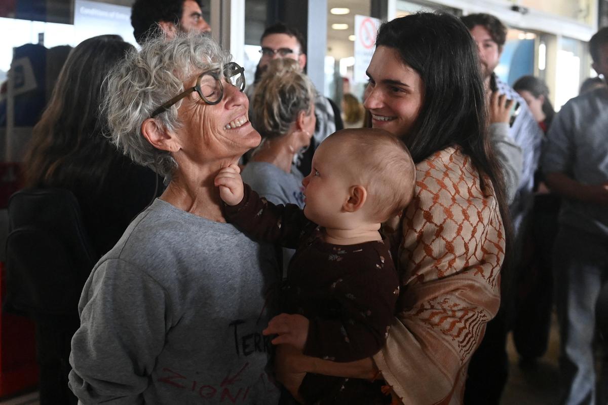 Anny Mokotow, an Australian member of the Gaza-bound Global Sumud Flotilla, which was intercepted by Israeli forces, is greeted by family members as she arrives back at Sydney International Airport, Sydney, Australia, May 25, 2026. REUTERS/Jeremy Piper