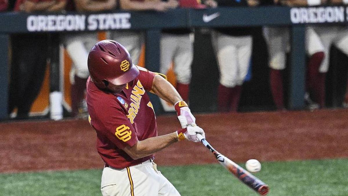  May 31, 2025; Corvallis, OR, USA; USC outfielder Jack Basseer (14) hits the ball during the eighth inning against Saint Mary's at the NCAA Corvallis Regional at Goss Stadium. Mandatory Credit: Troy Wayrynen-Imagn Images | Troy Wayrynen-Imagn Images 