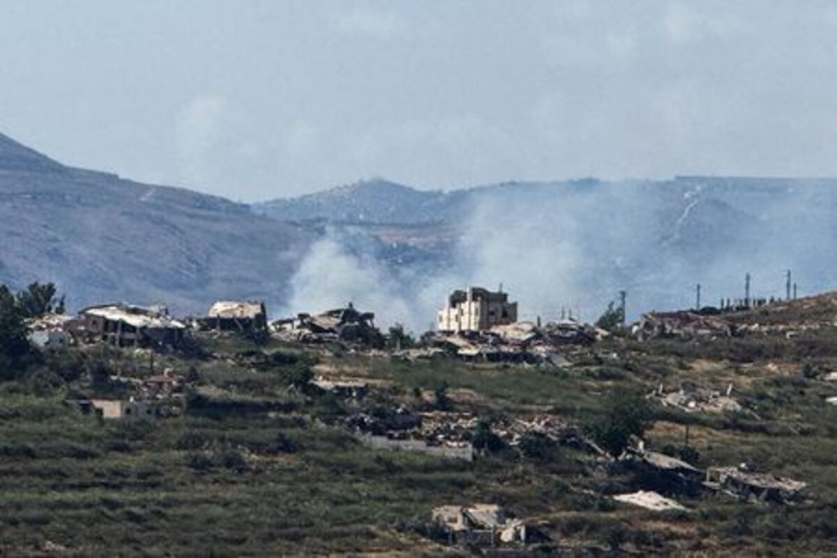 Smoke rises near destroyed structures in southern Lebanon, as seen from the Israeli side of the Israel-Lebanon border, in northern Israel, June 14, 2026. Picture taken with a mobile phone. REUTERS/Avi Ohayon