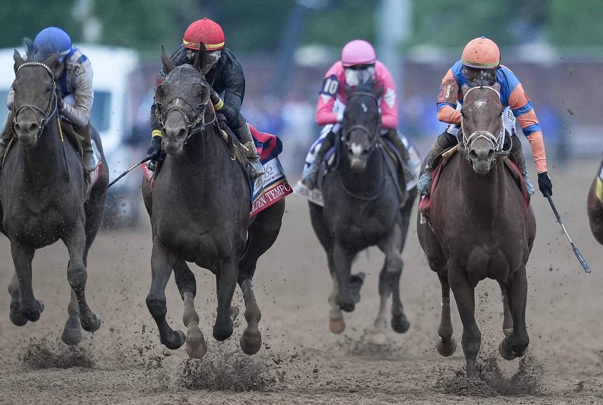  Golden Tempo jockey Jose Ortiz, in red helmet with black silks at the 2026 Kentucky Derby. Matt Stone/Courier Journal / USA TODAY NETWORK via Imagn Images