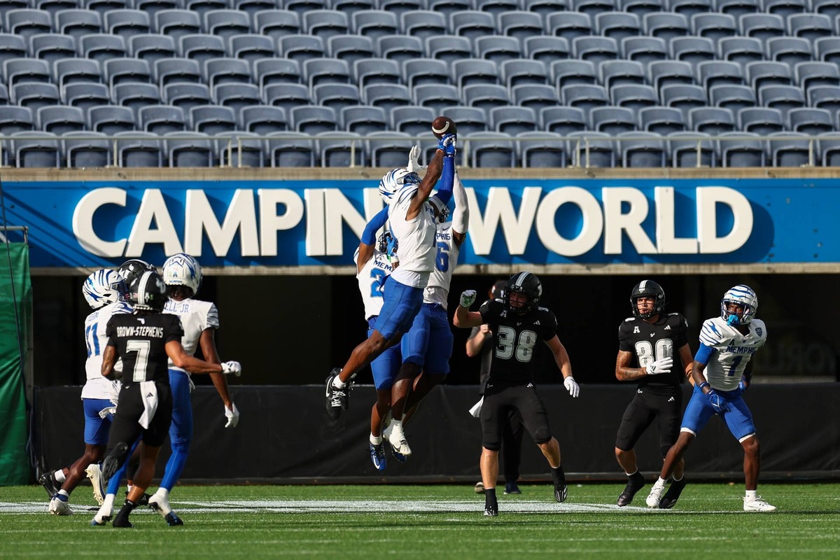  Memphis Tigers defensive back Kobee Minor breaks up a Hail Mary pass against the South Florida Bulls in the second quarter at Camping World Stadium. Nathan Ray Seebeck-Imagn Images