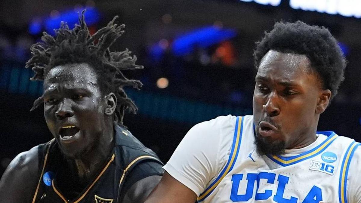  Mar 20, 2026; Philadelphia, PA, USA;UCF Knights center John Bol (7) grabs a rebound againist UCLA Bruins center Xavier Booker (1) in the first half during a first round game of the men's 2026 NCAA Tournament at Xfinity Mobile Arena. Mandatory Credit: Kyle Ross-Imagn Images | Kyle Ross-Imagn Images 