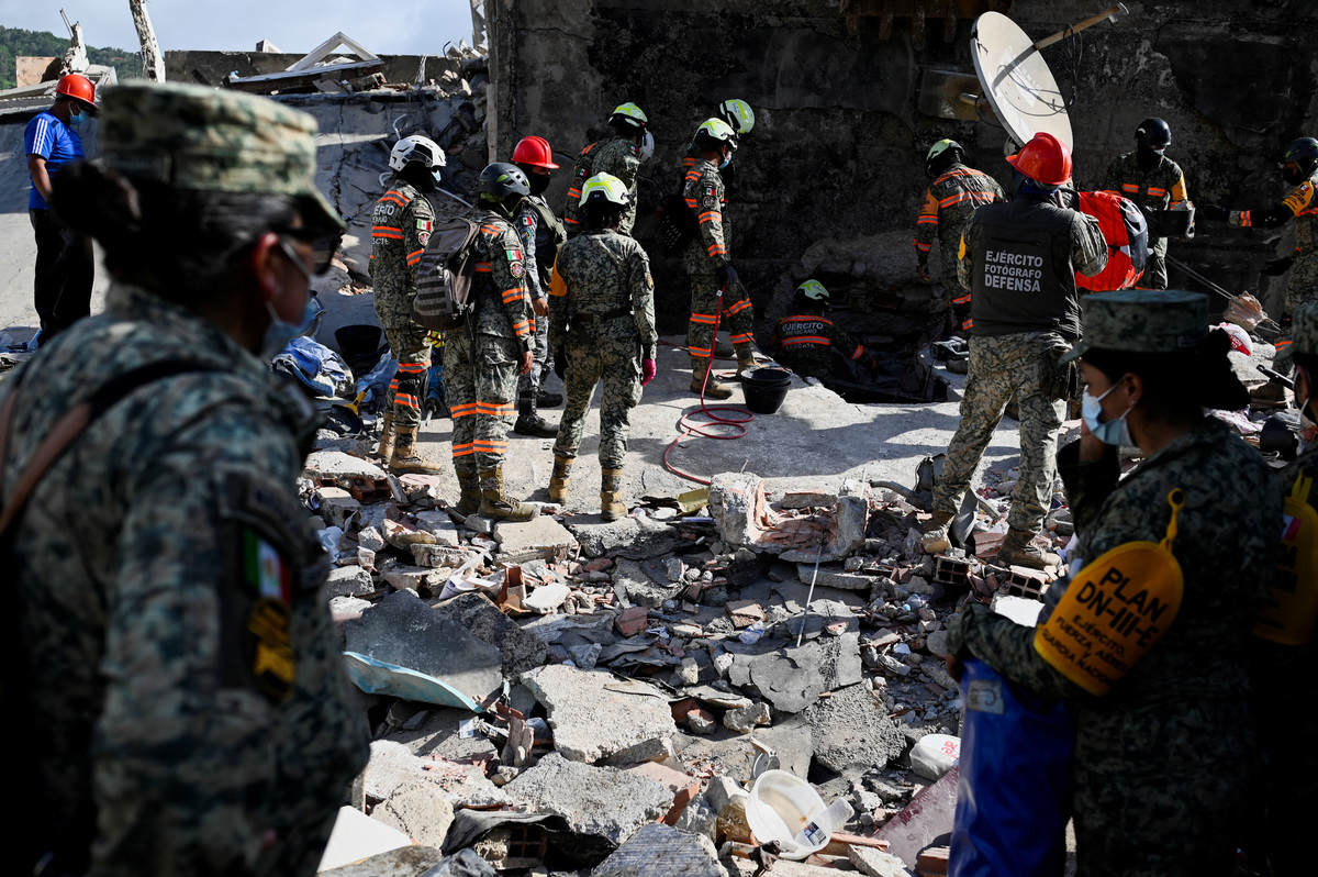 Rescue personnel work as rescue operations continue after earthquakes hit the country, in La Guaira, Venezuela, June 27, 2026. REUTERS/Maxwell Briceno