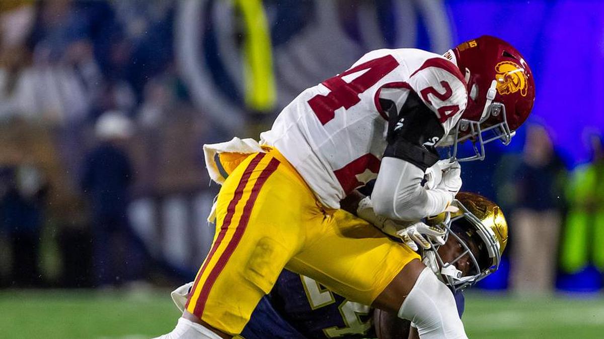  Oct 18, 2025; South Bend, Indiana, USA; Southern California Trojans safety Christian Pierce (24) hits Notre Dame Fighting Irish running back Jadarian Price (24) during the second half at Notre Dame Stadium. Mandatory Credit: Michael Caterina-Imagn Images | Michael Caterina-Imagn Images 