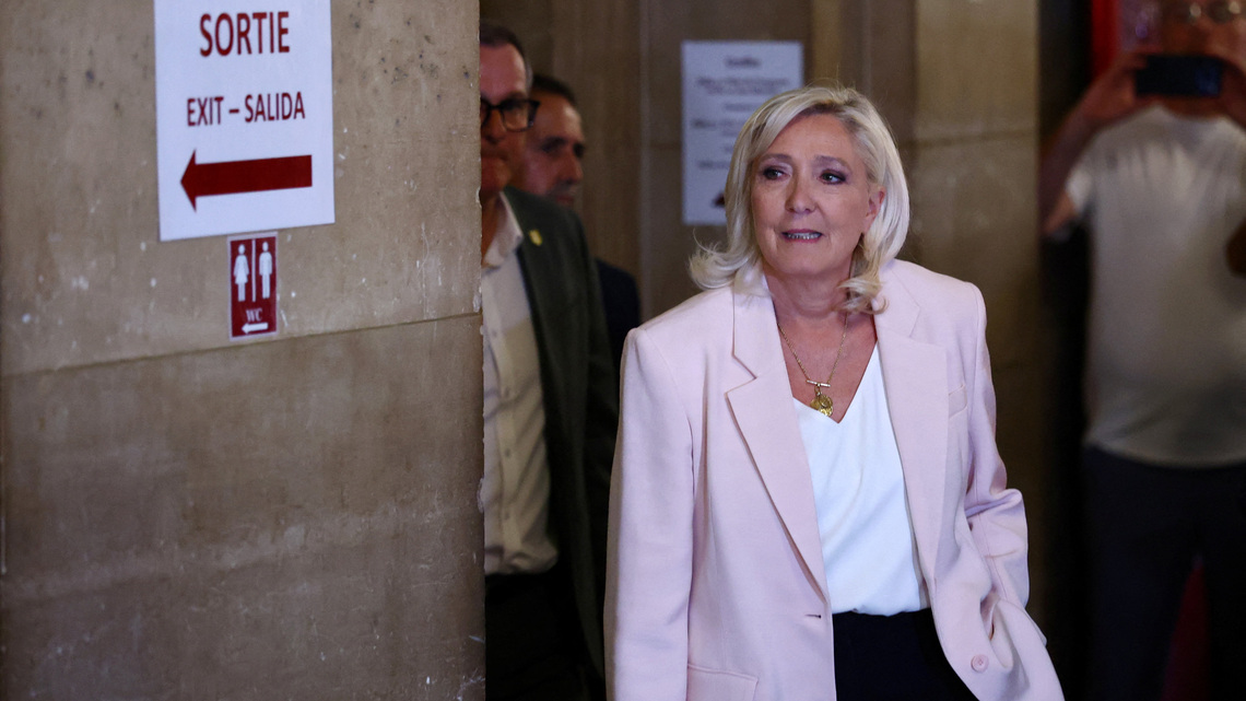 French court opens door for Marine Le Pen to run for president, with ankle tag 