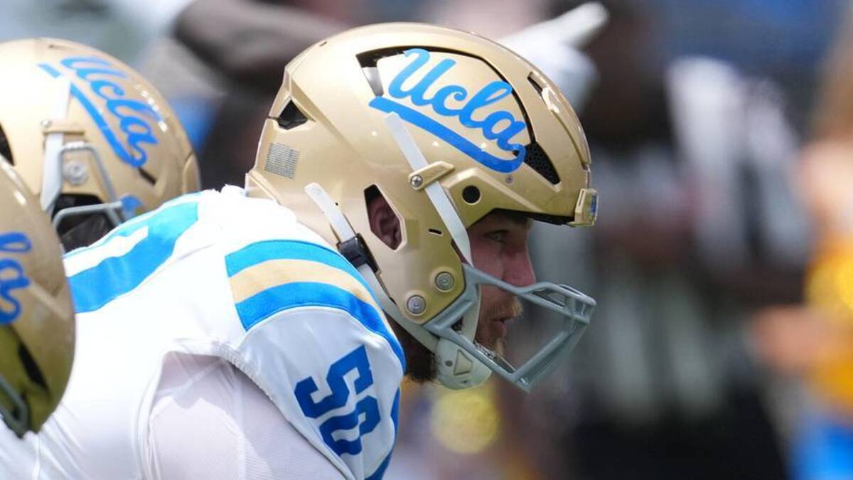  May 2, 2026; Pasadena, CA, USA; A general overall view of helmets at the line of scrimmage as UCLA Bruins center Riley Robell (50) snaps the ball during the spring game at Rose Bowl. Mandatory Credit: Kirby Lee-Imagn Images | Kirby Lee-Imagn Images 