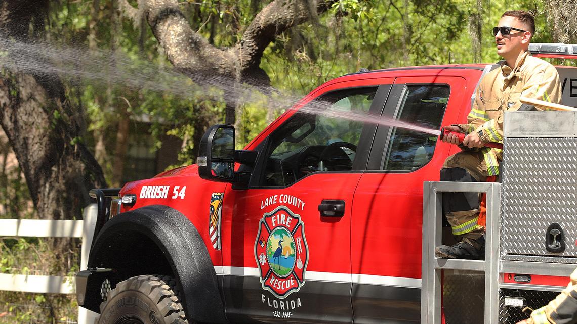 Lake County firefighters work near the scene of a brush fire off Gray’s Airport Road in Fruitland Park, Fla., on Thursday afternoon, April 17, 2025. The Orlando area faces a rainfall deficit of 5 inches this year. The low humidity and breezy conditions also have increased the risk for wildfires in rural areas. Burn bans are in effect in some Central Florida counties. (Stephen M. Dowell/Orlando Sentinel/TNS)