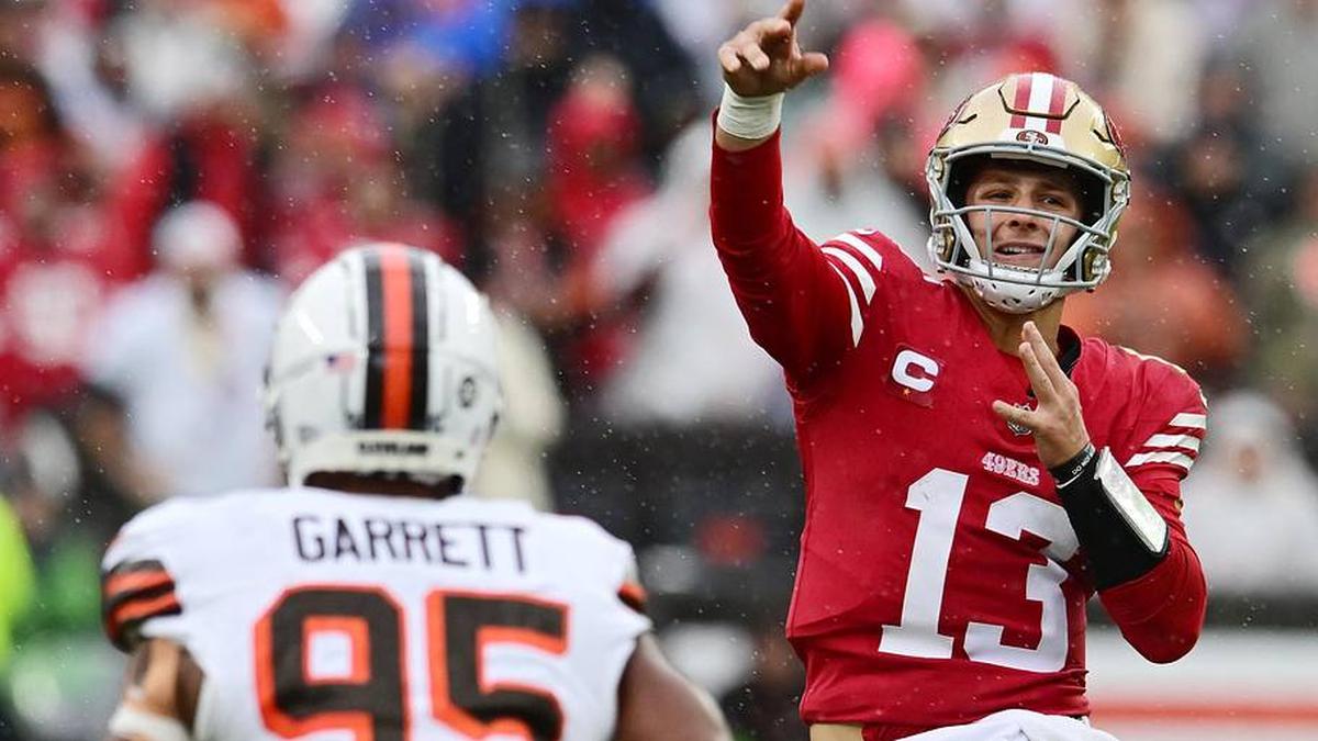  Oct 15, 2023; Cleveland, Ohio, USA; San Francisco 49ers quarterback Brock Purdy (13) throws a pass over Cleveland Browns defensive end Myles Garrett (95) during the first half at Cleveland Browns Stadium. Mandatory Credit: Ken Blaze-Imagn Images | Ken Blaze-Imagn Images 