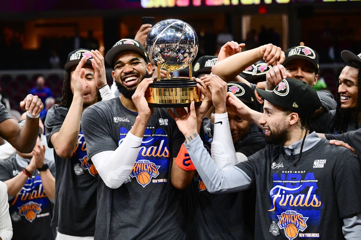  New York Knicks center Karl-Anthony Towns and guard Jose Alvarado help the team lift the trophy after defeating the Cleveland Cavaliers in the 2026 Eastern Conference finals. Ken Blaze-Imagn Images