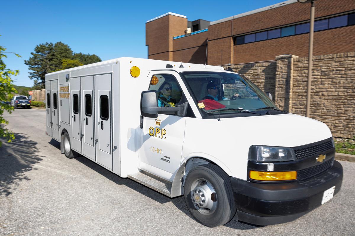 An Ontario Provincial Police offender transport vehicle arrives at the Superior Court of Justice, on the day when Kenneth Law, accused of selling lethal substances to people who later took their own lives, is expected to plead guilty to 14 counts of aiding suicide, in Newmarket, Ontario, Canada May 29, 2026. REUTERS/Carlos Osorio