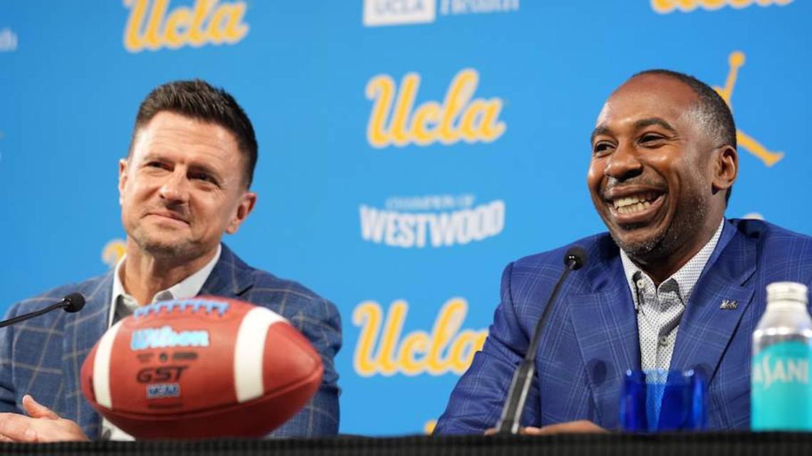  Dec 9, 2025; Los Angeles, CA, USA; UCLA Bruins football coach Bob Chesney (left) and athletic director Martin Jarmond at introductory press conference at Renee Luskin Conference Center Centennial Ballroom. Mandatory Credit: Kirby Lee-Imagn Images | Kirby Lee-Imagn Images 