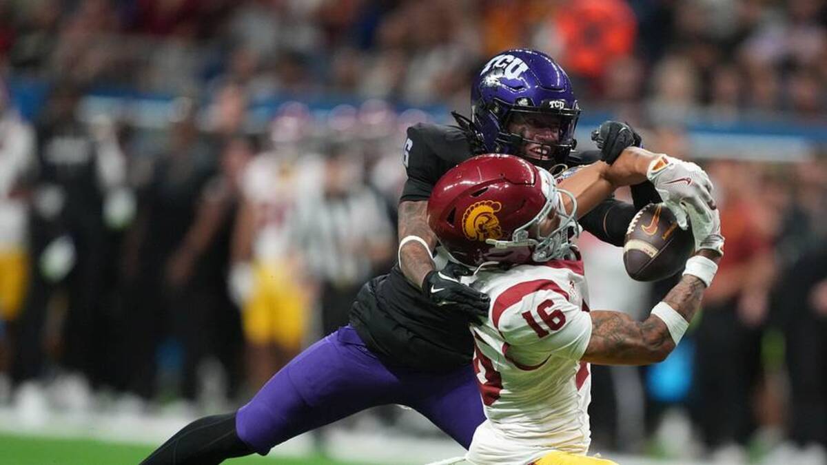  Dec 30, 2025; San Antonio, TX, USA; Southern California Trojans wide receiver Tanook Hines (16) catches the ball against TCU Horned Frogs cornerback Vernon Glover (26) in the second half during the Alamo Bowl at Alamodome. Mandatory Credit: Kirby Lee-Imagn Images | Kirby Lee-Imagn Images 