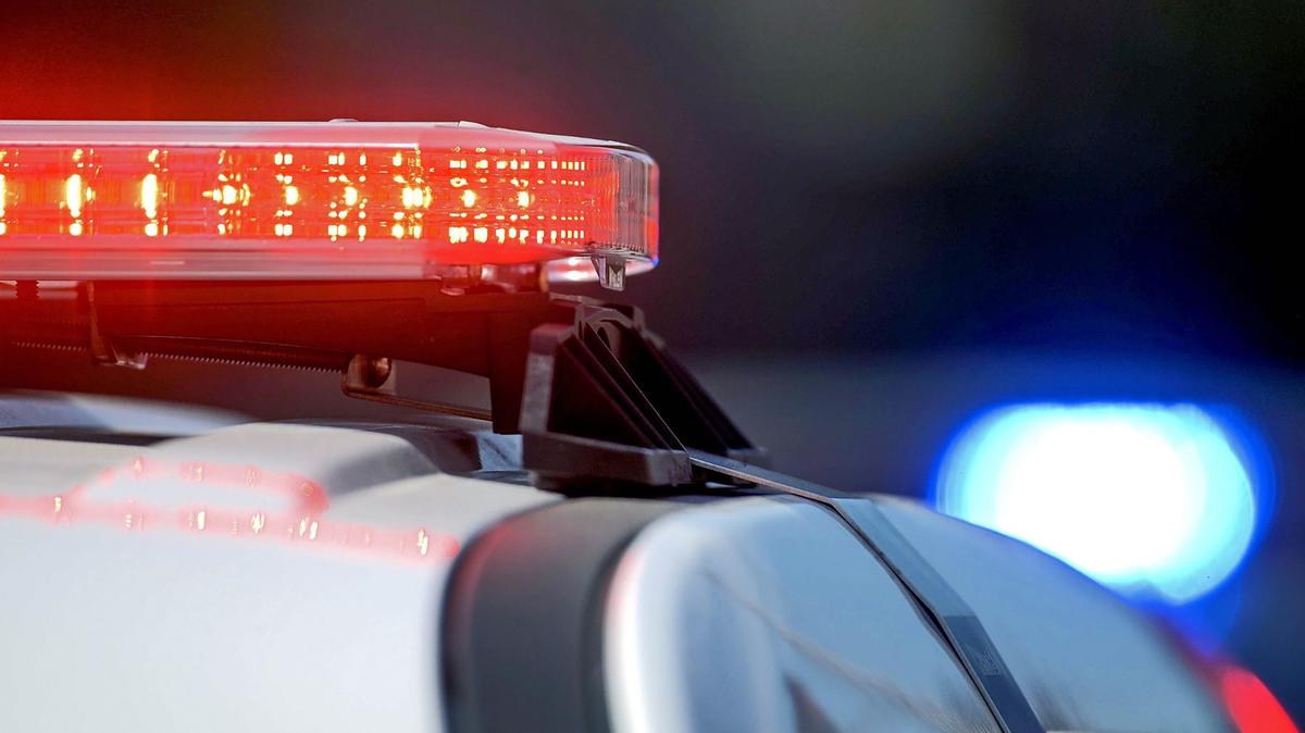 A woman is accused of kicking and hitting police officers after reports were made that she was blocking and running after cars near the Prosser Christmas Tree Lighting Festival.