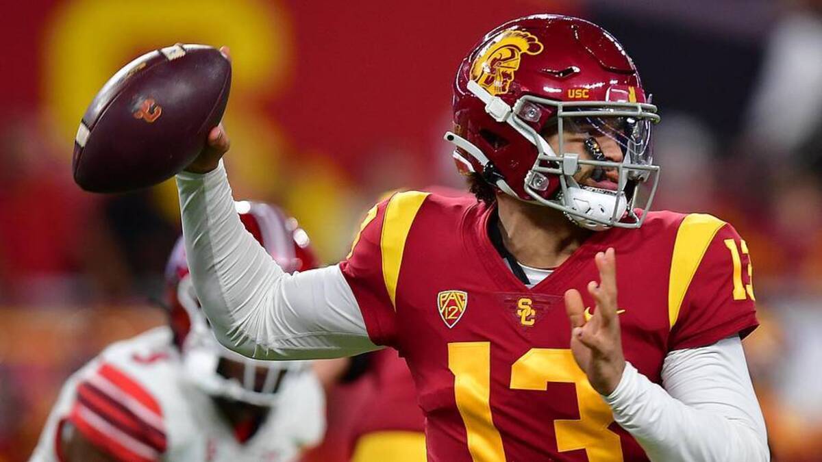  Dec 2, 2022; Las Vegas, NV, USA; Southern California Trojans quarterback Caleb Williams (13) throws against the Utah Utes during the first half of the PAC-12 Football Championship at Allegiant Stadium. Mandatory Credit: Gary A. Vasquez-Imagn Images | Gary A. Vasquez-Imagn Images 