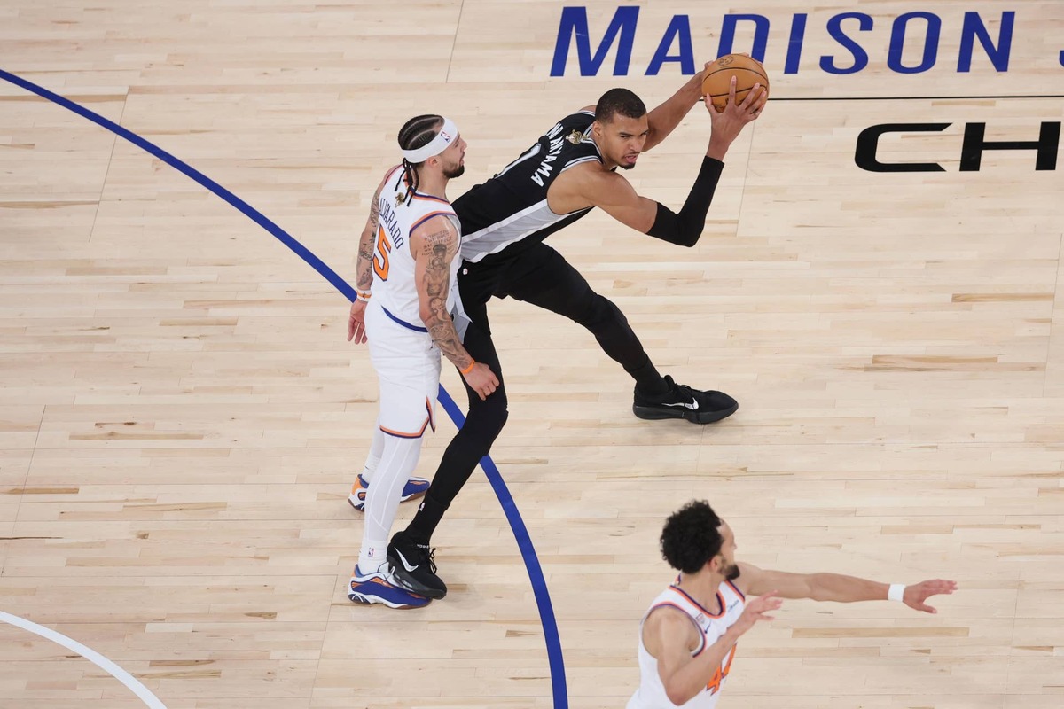  Jun 8, 2026; New York, New York, USA; San Antonio Spurs forward Victor Wembanyama (1) controls the ball against New York Knicks guard Jose Alvarado (5) during game three of the 2026 NBA Finals in the fourth quarter at Madison Square Garden. Mandatory Credit: Wendell Cruz-Imagn Images 