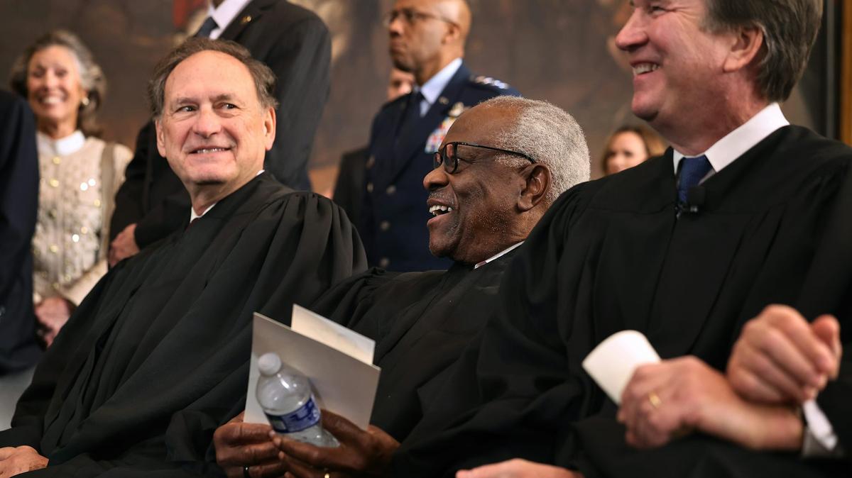 Supreme Court Justices Samuel Alito and Clarence Thomas share a laugh at the U.S. Capitol on Jan. 20, 2025. 