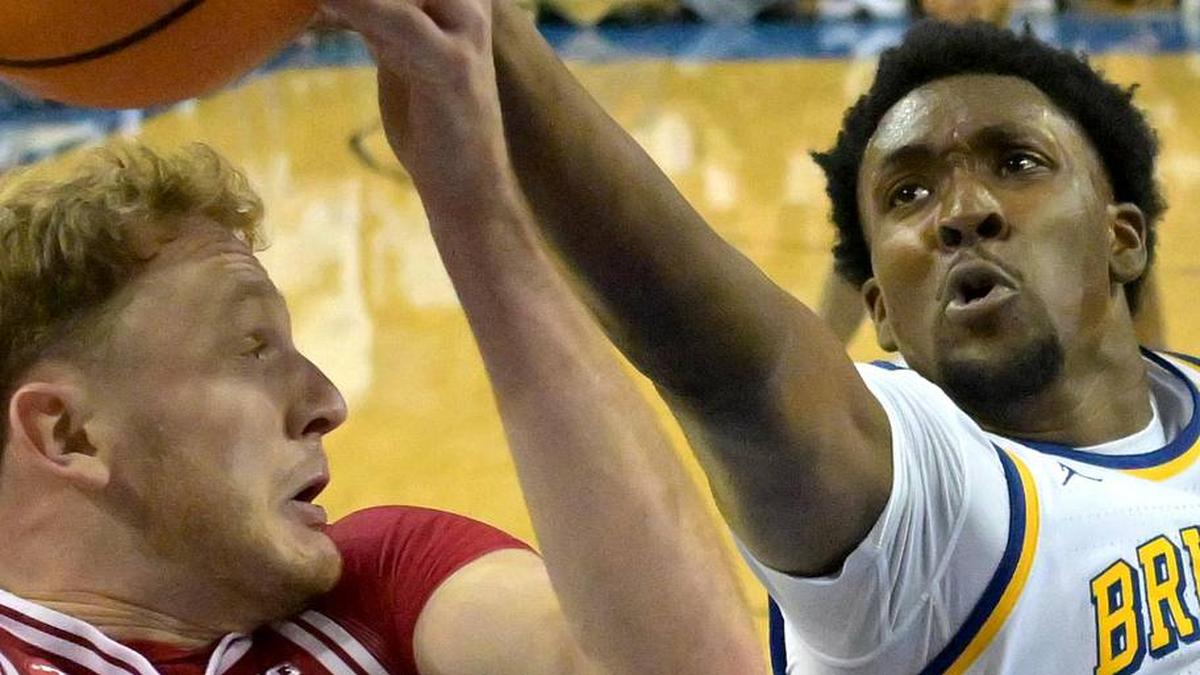  Jan 31, 2026; Los Angeles, California, USA; Indiana Hoosiers forward Tucker DeVries (12) and UCLA Bruins forward Xavier Booker (1) go for a rebound in the first half at Pauley Pavilion presented by Wescom Financial. Mandatory Credit: Jayne Kamin-Oncea-Imagn Images | Jayne Kamin-Oncea-Imagn Images 