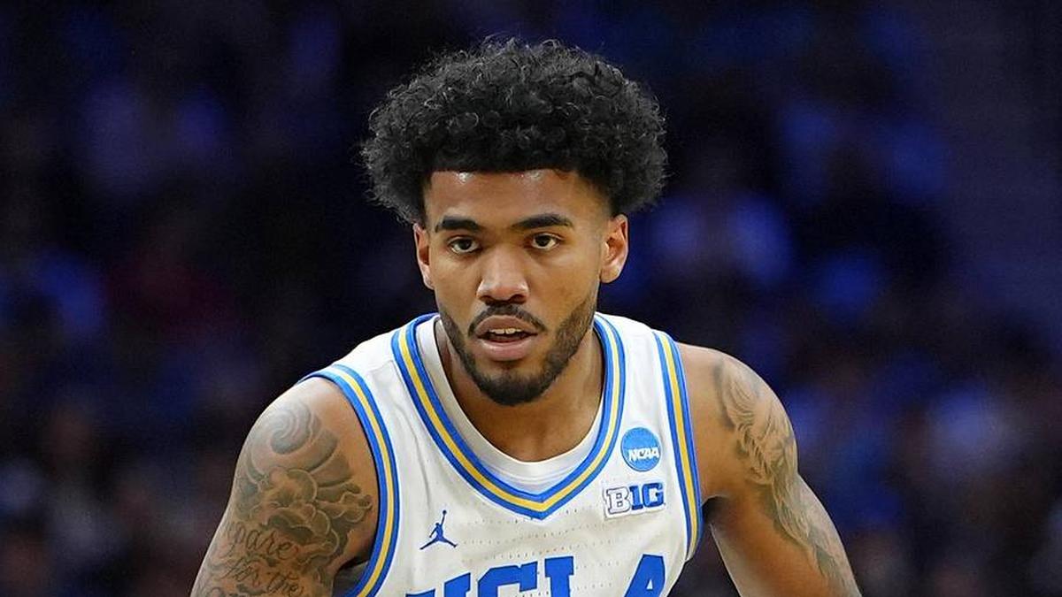  Mar 20, 2026; Philadelphia, PA, USA; UCLA Bruins guard Donovan Dent (2) dribbles the ball against UCF Knights guard Chris Johnson (22) in the first half during a first round game of the men's 2026 NCAA Tournament at Xfinity Mobile Arena. Mandatory Credit: Kyle Ross-Imagn Images | Kyle Ross-Imagn Images 