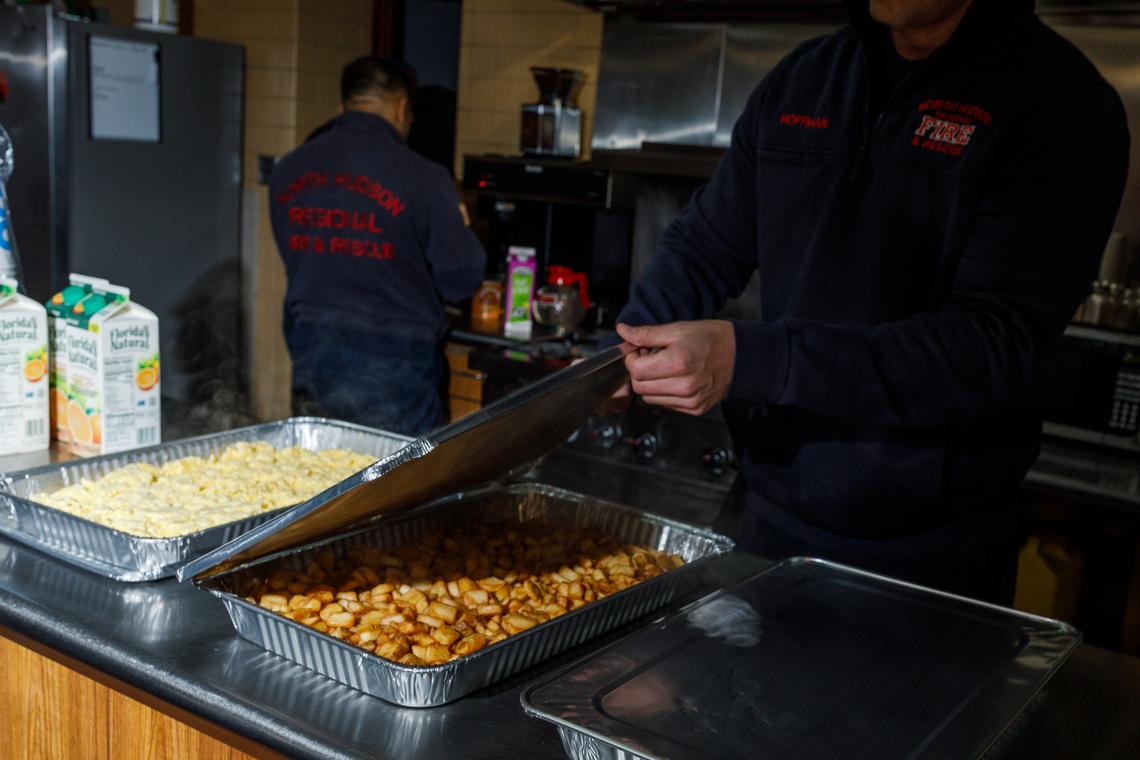 Firefighters get a catering order from IHOP ready for the rest of the crew at Union City Firehouse, in Union City, N.J., April 2, 2026. Restaurants like IHOP, Cracker Barrel and Red Lobster have found a new revenue source as return-to-office hits full force. (Brian Fraser/The New York Times)