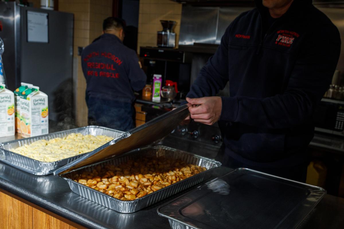 Firefighters get a catering order from IHOP ready for the rest of the crew at Union City Firehouse, in Union City, N.J., April 2, 2026. Restaurants like IHOP, Cracker Barrel and Red Lobster have found a new revenue source as return-to-office hits full force. (Brian Fraser/The New York Times)