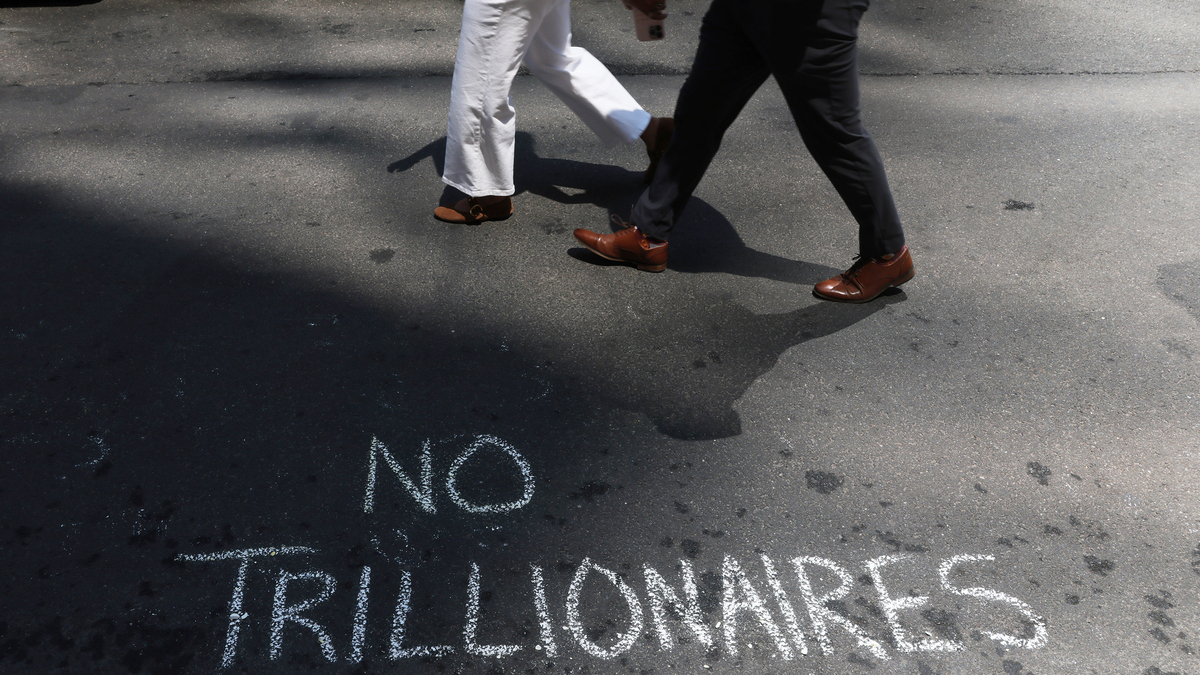 Protesters leave messages in chalk as they gather outside of JP Morgan's New York Headquarters on June 12, 2026, in New York City. Protesters demonstrated against Elon Musk and his extensive wealth following the launch of the SpaceX initial public offering (IPO) on the Nasdaq. The protest took place outside of the bank that helped to finance the historic IPO which has made Elon Musk, the founder, CEO, and Chief Engineer of SpaceX (Space Exploration Technologies Corp.), the world’s first trillionaire.