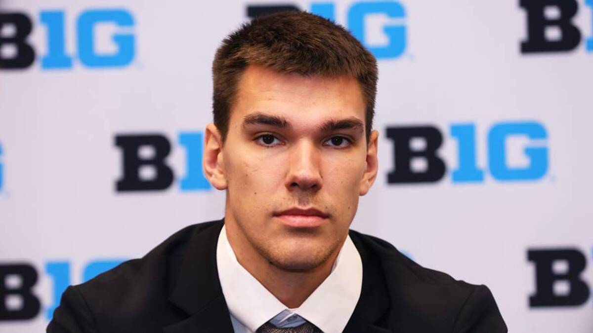  Oct 3, 2024; Rosemont, IL, USA; Michigan center Vlad Goldin takes a question at the podium during the 2024 Big Ten Men's Basketball media day at Donald E. Stephens Convention Center. Mandatory Credit: Melissa Tamez-Imagn Images | USA TODAY Sports via Reuters Connect 