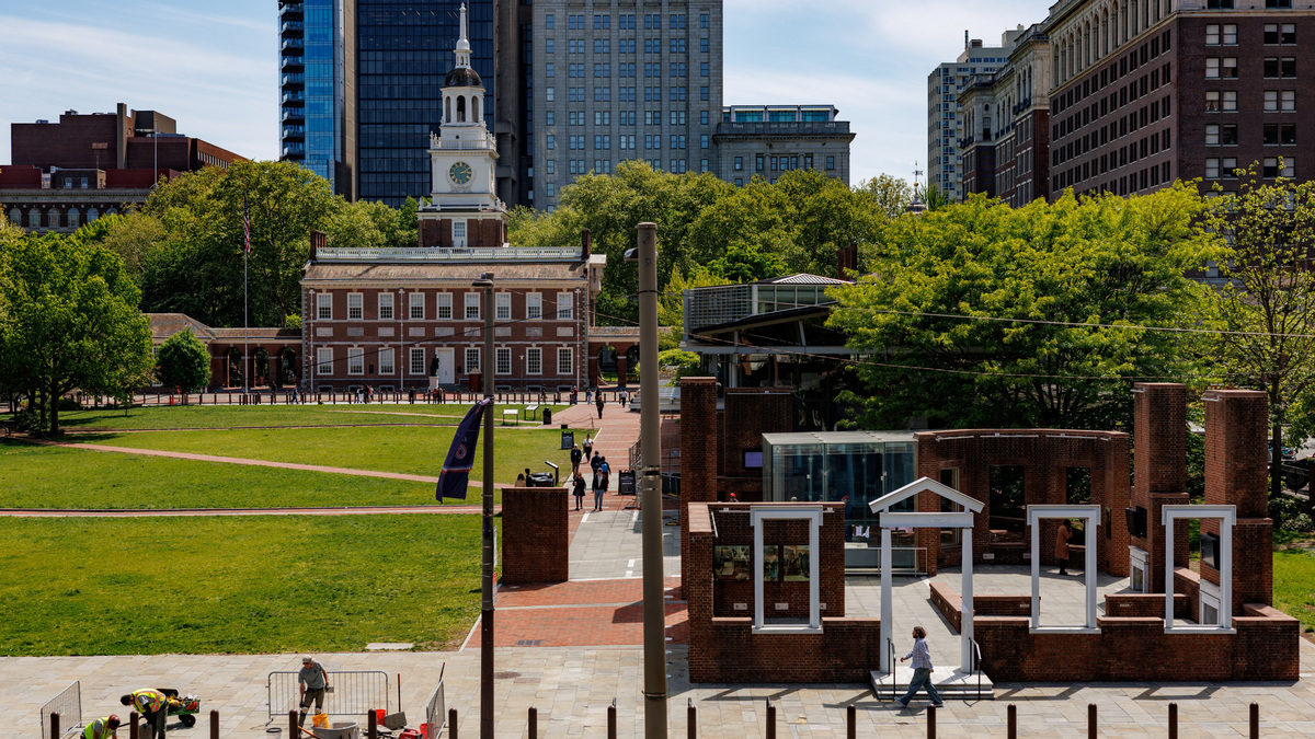 People walk past the President's House Site in Philadelphia, Pennsylvania, U.S., May 1, 2026.  REUTERS/Hannah Beier