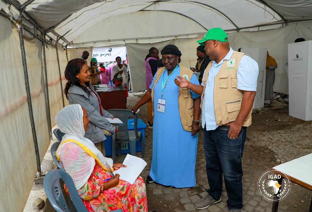 Dr. Specioza Wandira Kazibwe, Head of the IGAD Election Observer Mission, talks to polling agents at a polling station during the parliamentary and regional elections in Addis Ababa, Ethiopia, June 1, 2026. The Intergovernmental Authority on Development (IGAD)/Handout via REUTERS