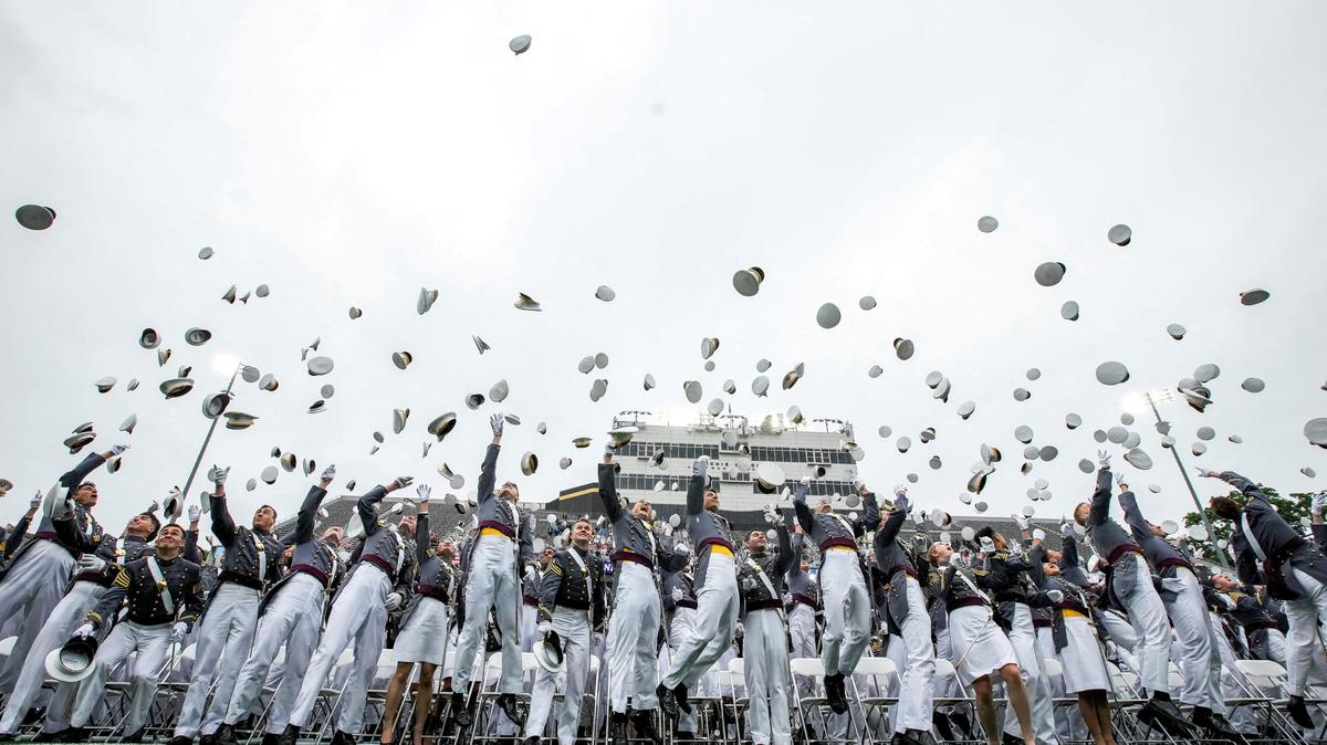 FILE PHOTO: Cadets throw their hats in the air during the commencement ceremony for the U.S. Military Academy (USMA) at West Point, New York, U.S., May 23, 2026. REUTERS/Eduardo Munoz/File Photo