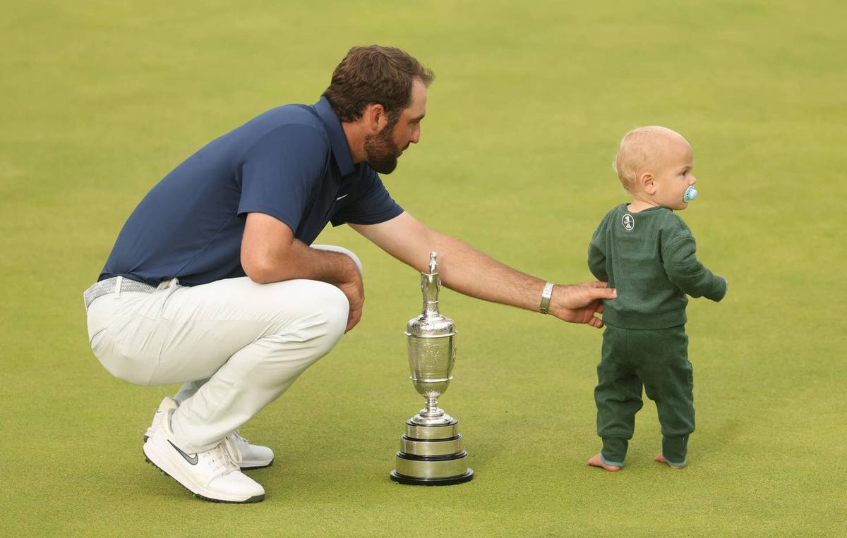  Scottie Scheffler celebrates with his son, Bennett, and the Claret Jug after winning the 153rd Open Championship at Royal Portrush in Northern Ireland on July 20, 2025. Mike Frey-Imagn Images