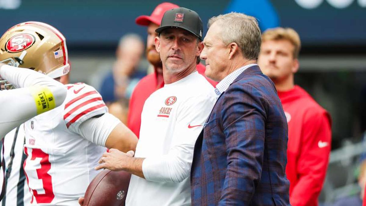  Sep 7, 2025; Seattle, Washington, USA; San Francisco 49ers general manager John Lynch, right, talks with head coach Kyle Shanahan during pregame warmups against the Seattle Seahawks at Lumen Field. Mandatory Credit: Joe Nicholson-Imagn Images | Joe Nicholson-Imagn Images 