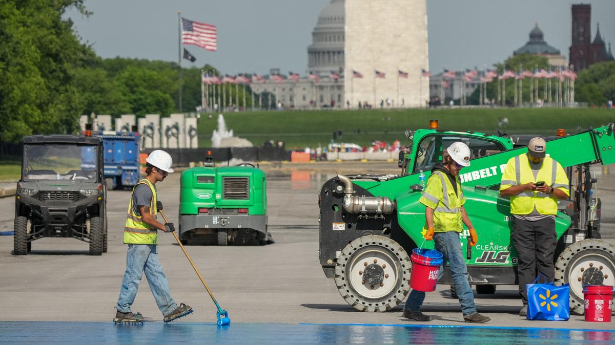 Workers continue renovations on the Lincoln Memorial Reflecting Pool, which is painted blue, in Washington, D.C., U.S., May 2, 2026. REUTERS/Ken Cedeno