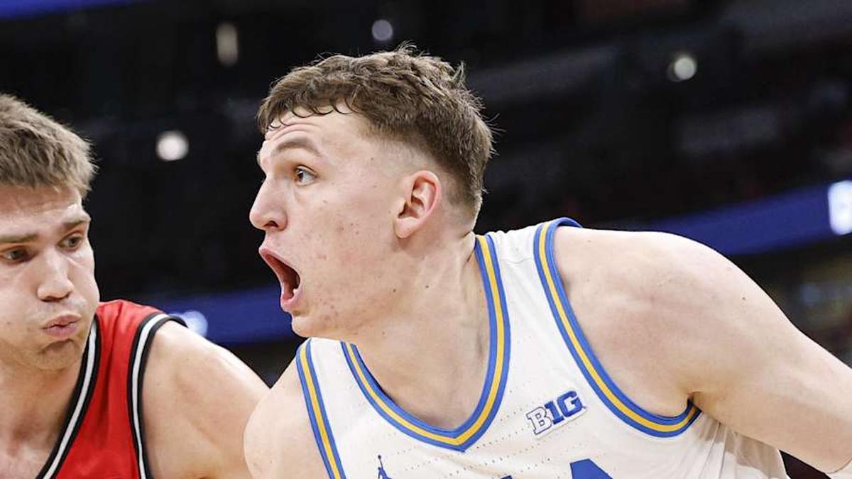  Mar 12, 2026; Chicago, IL, USA; UCLA Bruins forward Tyler Bilodeau (34) drives to the basket against Rutgers Scarlet Knights guard Harun Zrno (13) during the second half at United Center. Mandatory Credit: Kamil Krzaczynski-Imagn Images | Kamil Krzaczynski-Imagn Images 