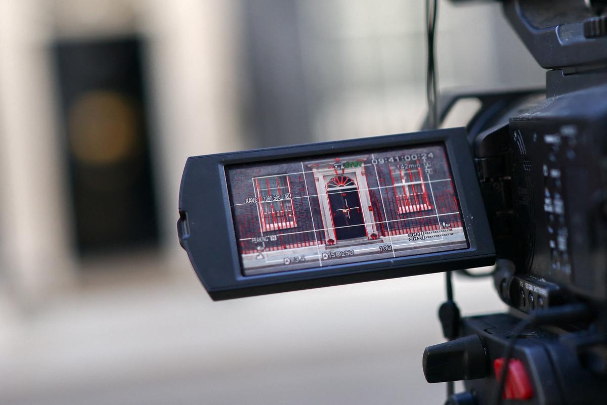 The door to No. 10 Downing Street appears in a camera screen as members of the media work outside, ahead of a British cabinet meeting the day before the State Opening of Parliament, in London, Britain, May 12, 2026. REUTERS/Jack Taylor
